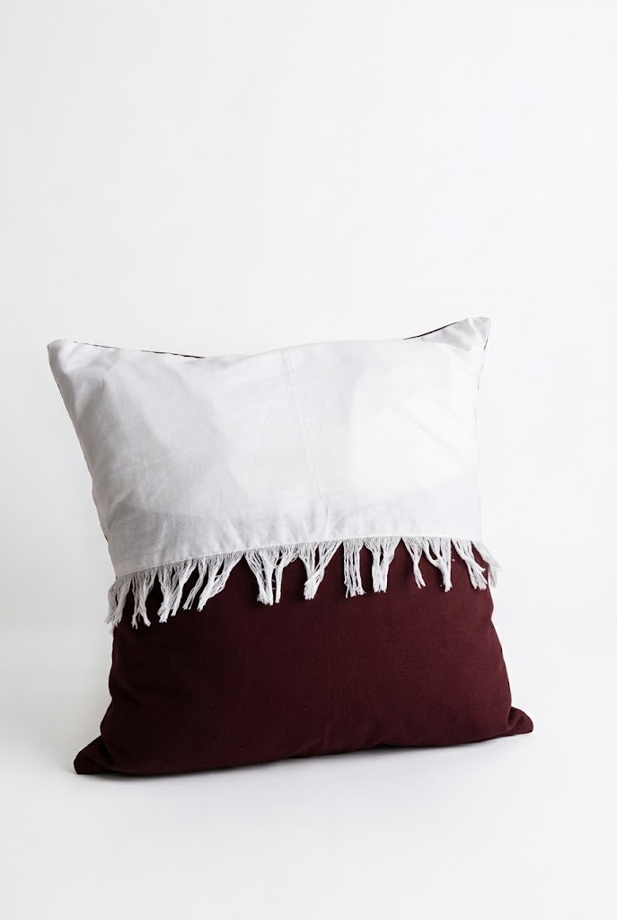 White & brown cushion with drawn tread 